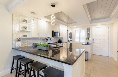 Jupiter Bay Condo | Modern Luxury, Waterfall, Pool, 1/2 mile to Beach