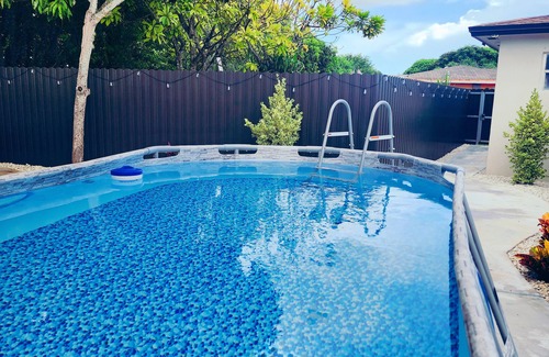 Homestead House | Modern mobile home with pool and private patio.