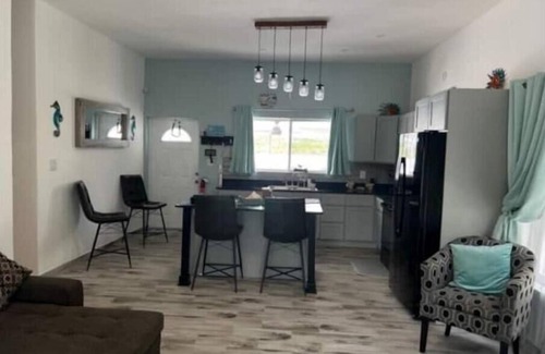 Cockburn Town House | Modern ocean villa with heated pool