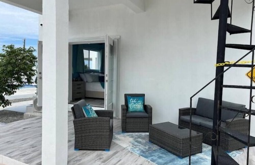 Cockburn Town House | Modern ocean villa with heated pool