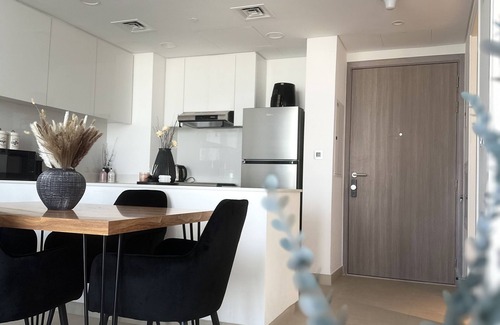 Sharjah Apartment | Modern sanctuary with pool and gym access in downtown aljada