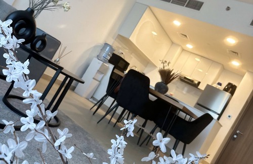 Sharjah Apartment | Modern sanctuary with pool and gym access in downtown aljada