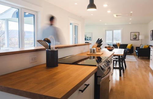 Margaree Forks House | Modern style home with spectacular views of the Margaree River.