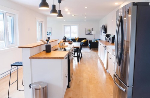 Margaree Forks House | Modern style home with spectacular views of the Margaree River.