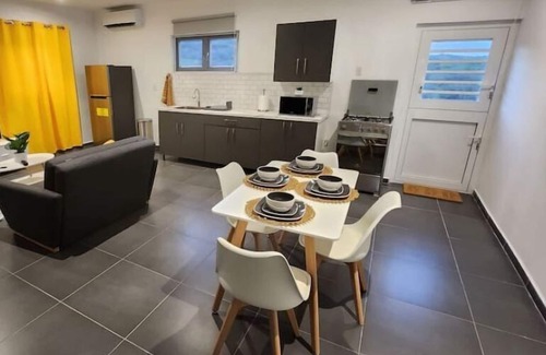 Tera Kora Apartment | Modern sunshine yellow apartment with nature views
