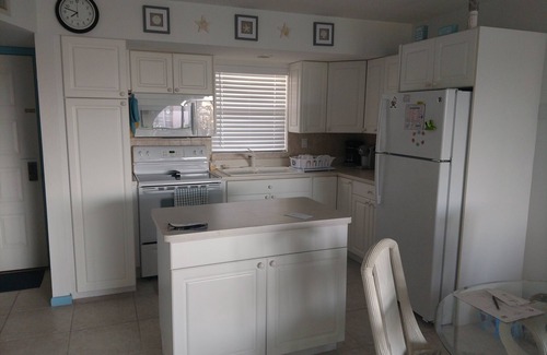 Marco Island Condo | Modern top floor with a beautiful view of the bay, pool, waterfront restaurant