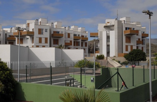 El Medano Apartment | Modern two floor apartment right by the beach with pool, patio and paddle court