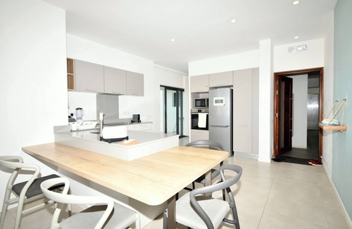 Poste Lafayette Villa | Modern White and Blue on the beach with pool