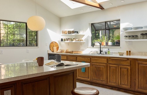 Hacienda House | Modern wooded gem with fast WiFi, charming deck, fireplace, W/D & central AC