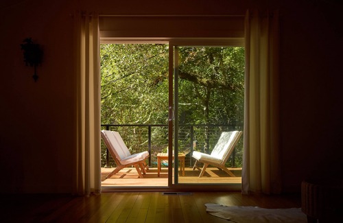 Hacienda House | Modern wooded gem with fast WiFi, charming deck, fireplace, W/D & central AC