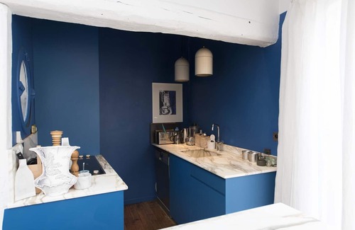 Quartier de Rochechouart Apartment | Modernist Style by the Folies Bergère, by Veeve