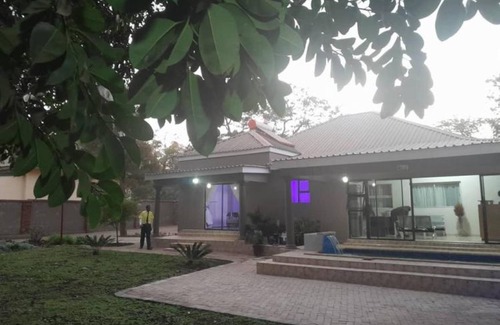 Kadoma Apartment | Modernly Furnished Standard Room With Queen bed - 2220