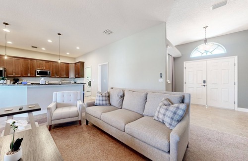 Plant City House | Modernly updated open home with lake view, screened-in patio, grill, AC, & W/D