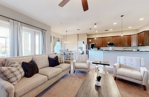 Plant City House | Modernly updated open home with lake view, screened-in patio, grill, AC, & W/D