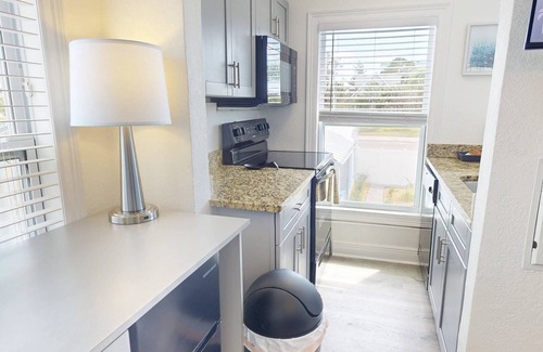 Treasure Island Condo | “Moonlight” 1BR Upstairs w/Courtyard View, Walk to Beach & Shops, King Bed, Full Kitchen