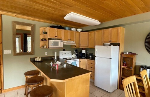 Okanagan-Similkameen Condo | Morning sun, private deck, hot tub, cozy living space, serenity!