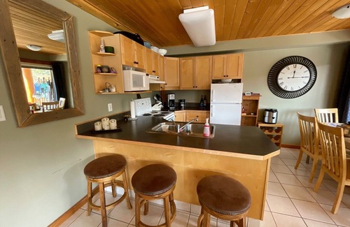 Okanagan-Similkameen Condo | Morning sun, private deck, hot tub, cozy living space, serenity!