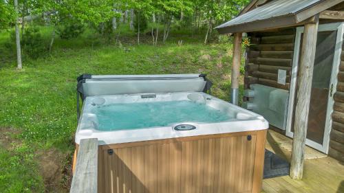 Lansing House | Mountain Top Cabin! Hot tub, Fireplace, Dog Friendly