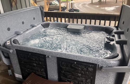 New Hope Cabin | Mr Hills Mercantile Cabin with a hot tub