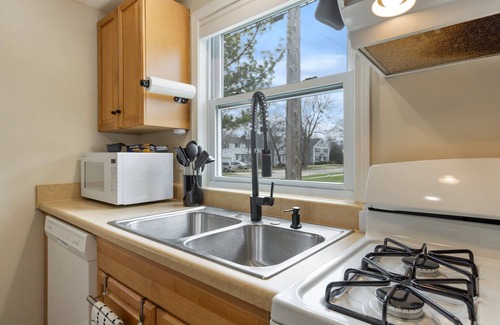 East Lansing House | MSU 2BR Home w/Garage, EV Charger, Patio & Grill – Walk to Campus