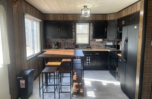 Cheboygan Cabin | Mud Creek Cottage waterfront acre lot & game-room