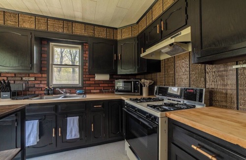 Cheboygan Cabin | Mud Creek Cottage waterfront acre lot & game-room
