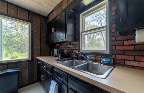 Cheboygan Cabin | Mud Creek Cottage waterfront acre lot & game-room