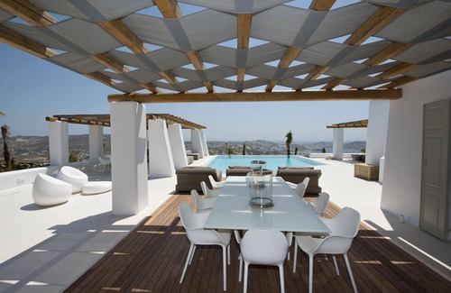 Tourlos Villa | My Rental Homes - Villa Opallia with spacious living and dining areas and a pool