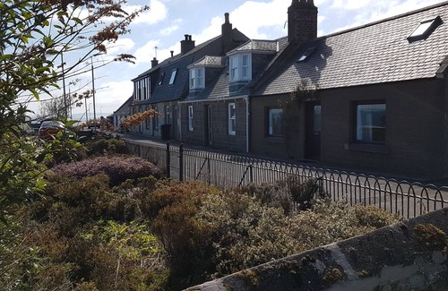 Johnshaven Cottage | Myrtle Cottage set in an elevated location with spectacular sea views.