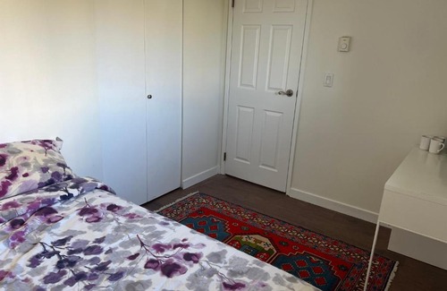 Central Lonsdale Bed & Breakfast | Naomi Home A cozy private room