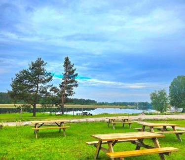 Jurmala Other | Natura Park Jurmala campsite with tent sites near a river
