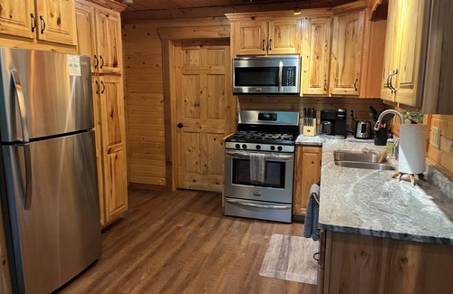 Wautoma Cabin | Natures retreat! Lakeside log cabin on 7 acres! Hike, Fish, Swim, Kayak, Spa!