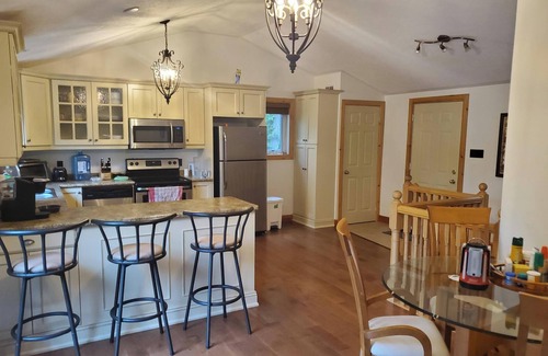 Wymbolwood Beach Cottage | Near Sandy Beach, Comfy Cottage - Multi leveled Deck with Woodland Backdrop
