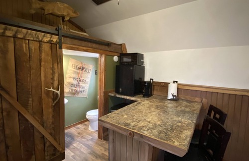 Gray Hawk Cabin | Nestled in woods a stone's throw from Daniel Boone Forest and 600 mi of trails .