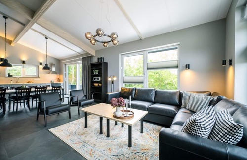 Ballum House | Neuws Holidayhome Panda with terrace on south, near woods
