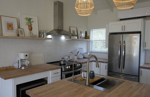 Great Exuma Villa | NEW 2 bdrm Sunrise Villa on 1+ acre tropical garden directly on Hoopers Beach