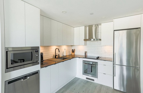 Cultural District Condo | NEW 2-bedroom condo in Downtown Kelowna with LAKE views & 25th FL access