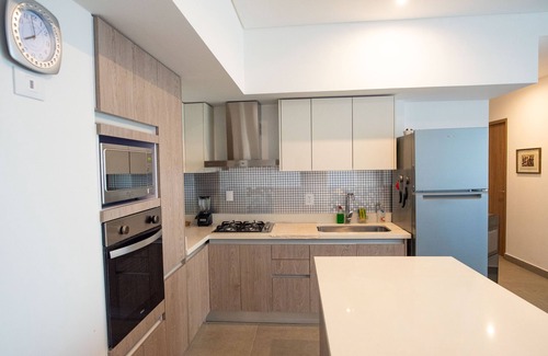 Zona Industrial Condo | New 2BR Condo in front of the US Consulate