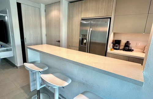 Isla Verde Apartment | NEW 3/2 GARDEN APT. FULL BACKUP GENERATOR, 2 POOLS, NEAR BEACH, GYM, 2 PARKINGS.