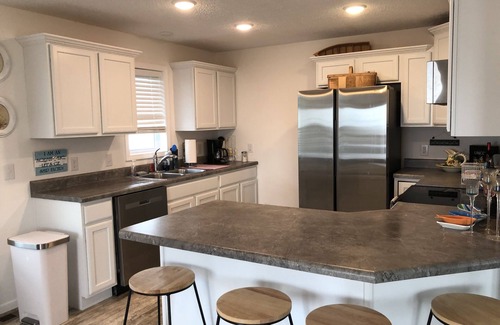 Oak Harbor House | New! 30 seconds from couch to shore, covered front porch w/sunset water views.