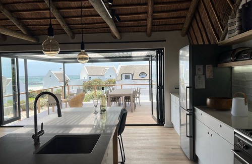 Kommetjie House | New and gorgeous Beach House with Hot Tub steps from Long Beach's surf breaks