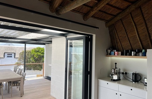 Kommetjie House | New and gorgeous Beach House with Hot Tub steps from Long Beach's surf breaks