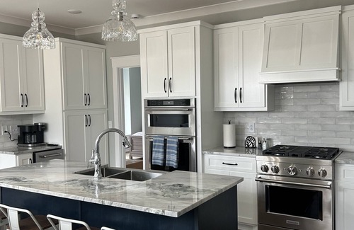 Sparta House | New, Craftsman bungalow. Porch with fireplace, hot tub, wooded, lake view