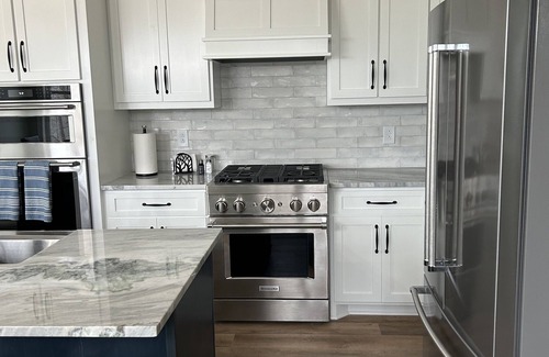 Sparta House | New, Craftsman bungalow. Porch with fireplace, hot tub, wooded, lake view