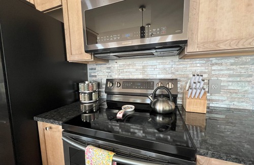 Suttons Bay House | NEW! Direct waterfront Grand Traverse Bay-Suttons Bay. Kayaks, Sandy