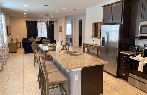 West Kissimmee Villa | NEW! Elegant 8BR Retreat w/Private Pool, Spa & Family-Friendly Comfort