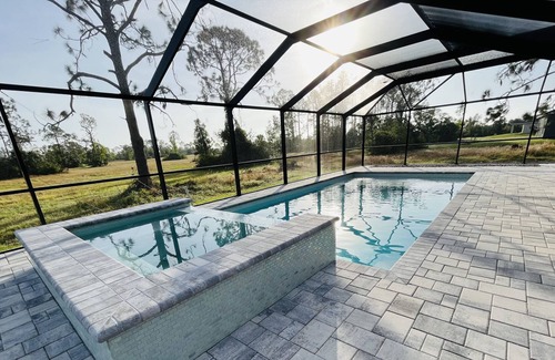 Jacarandas House | New heated pool/spa overlooking natural florida preserve.