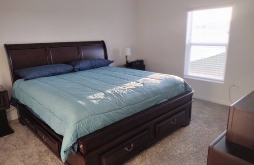 Haines City House | New House 25 Minutes from Disney World with King size bed and Community Pool.