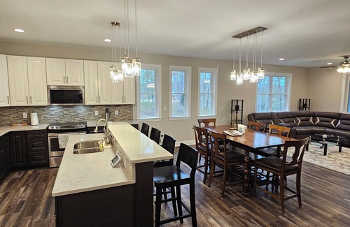 Livingston House | New Luxury Lakefront Getaway! Panoramic Views, New Hot Tub, Game Room & Kayaks!