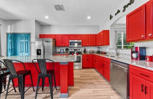 West Kissimmee Villa | NEW! Mickey's Island Escape - 6 Bedroom w/Pool Slide